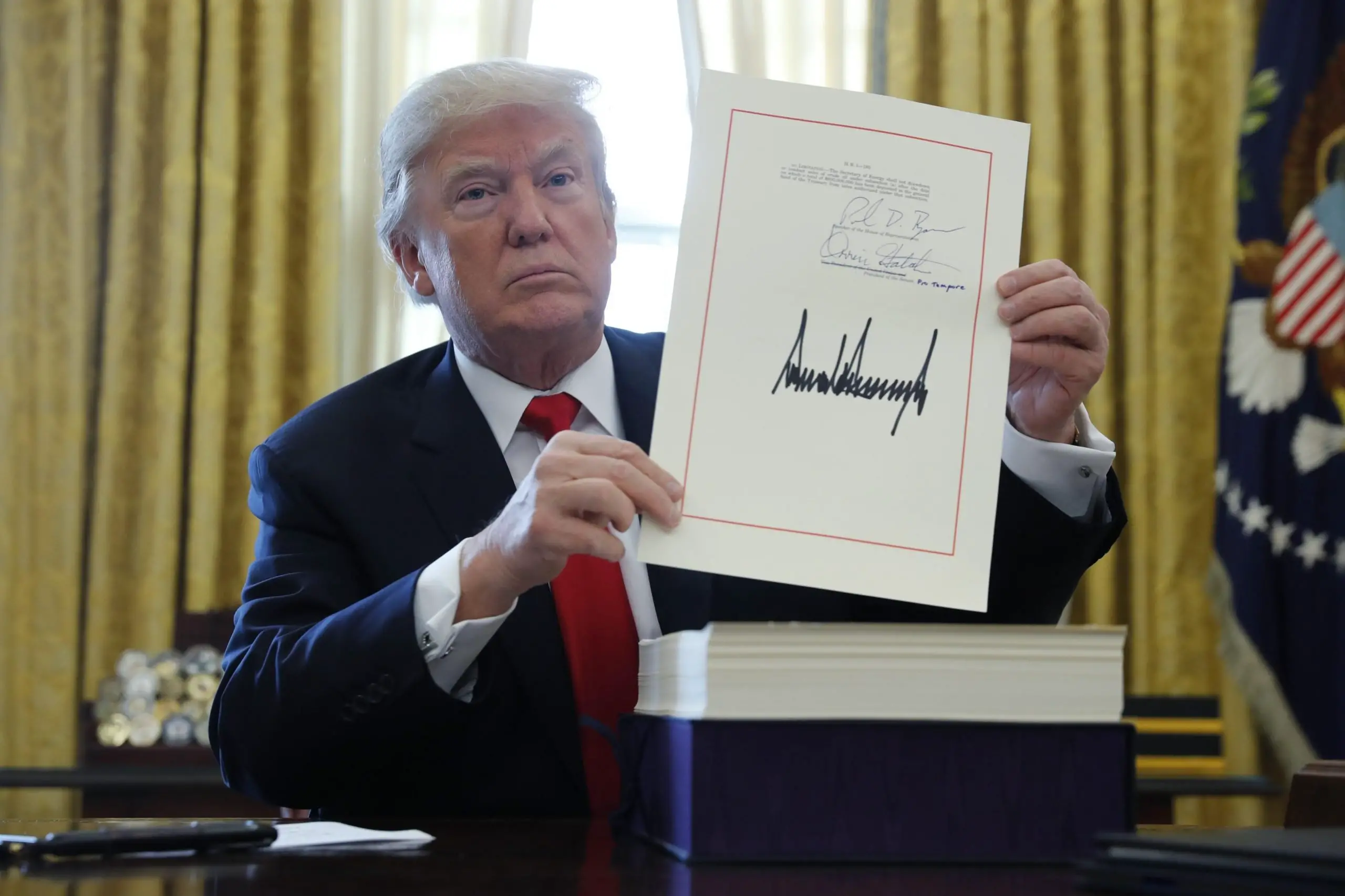 Trump signs tax, government spending bills into law